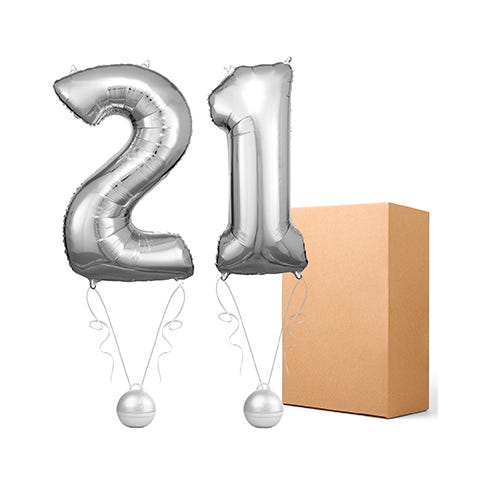 Large foil 2 and 1 silver balloon alongside a brown cardboard box