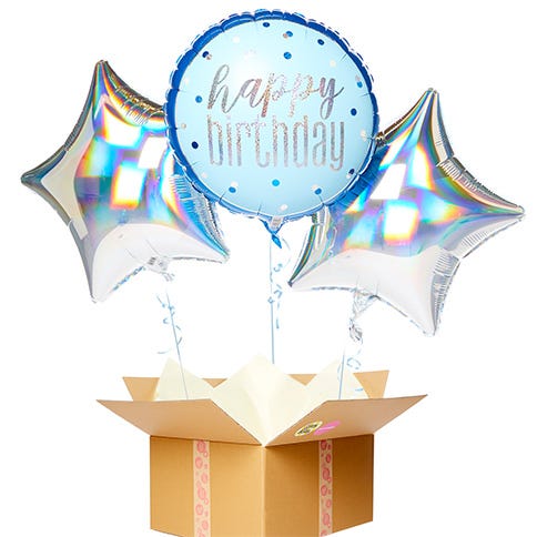 A happy birthday balloon bouquet featuring two silver star balloons either side of a blue happy birthday balloon popping out of a brown cardboard box
